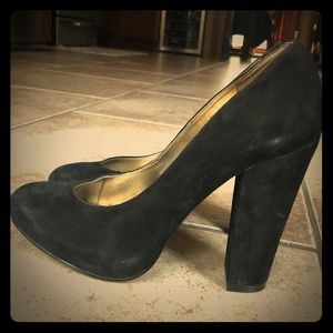 Black suede platform heels.